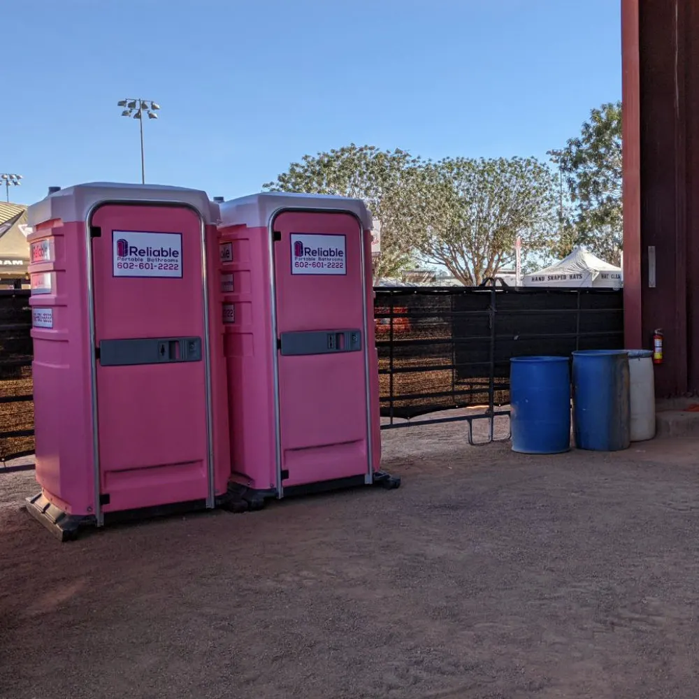 Portable restroom trailer set up in an outdoor event area