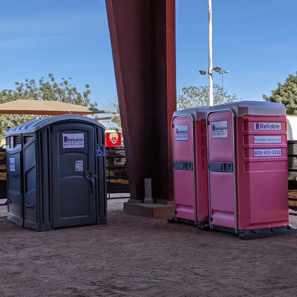 Portable bathroom units lined up outdoors