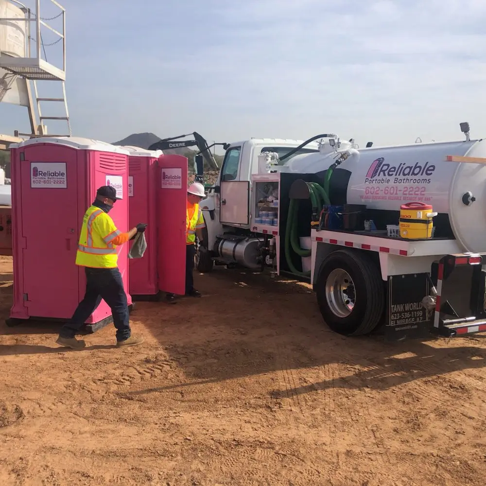 Portable bathroom trailers lined up outdoors